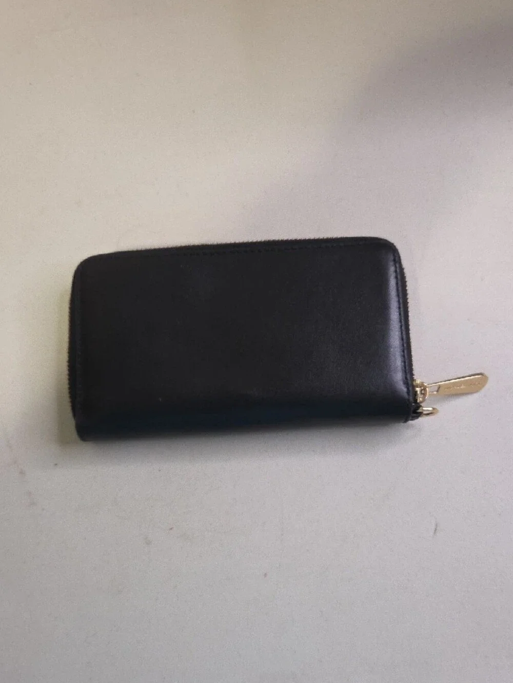 Michael Kors Black Leather Zip-Around Wallet with Floral Emboss and Gold Logo